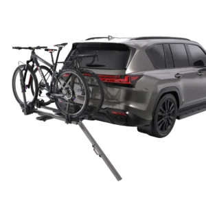 Integrated loading ramp being used to push a heavy e-bike onto the platform hitch carrier